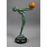 An Art Deco model of a nude holding a ball, signed Max Le Verrier height 33cm