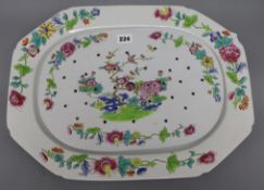 A Spode dinner plate and drainer