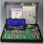 A cased silver-mounted shoehorn and buttonhook set, a collection of buttonhooks and sundries, the