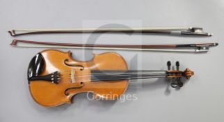 A violin with two-piece back cased with two bows 22.5in.