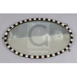A George III Irish oval framed mirror, c.1800, with blue and milk glass border, 2ft 3.5in. x 1ft 5.