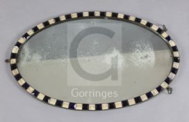 A George III Irish oval framed mirror, c.1800, with blue and milk glass border, 2ft 3.5in. x 1ft 5.