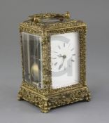 A late 19th century French cast bronze hour repeating carriage clock, the case decorated with