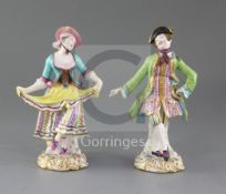 A pair of Minton figures of male and female dancers, c.1840-5, on flower painted scrollwork bases,