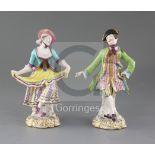 A pair of Minton figures of male and female dancers, c.1840-5, on flower painted scrollwork bases,