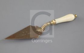 A yellow and gilt metal 'trowel' propelling pencil-cum-letter opener, with ivory handle, retailer'