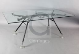 A Norman Foster for Tecno 'Nomos' glass top table, W.5ft 11in. D.2ft 11.5in. H.2ft 3in.
