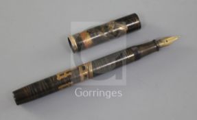 A Dunhill Namiki Maki-e fountain pen decorated by Shogo Lijima c.1930, the cap depicting houses