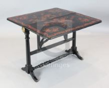 An unusual Victorian ebonised Sutherland table, with raised red lacquered chinoiserie floral and