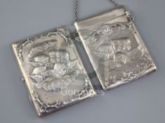 Two Victorian silver card cases, each embossed and chased with Reynold's Angels, the first by
