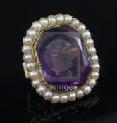 A large gold, amethyst and pearl dress ring with hinged expanding shank, the emerald cut stone