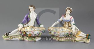 A pair of 19th century Minton reclining figures with baskets in Dresden style, c.1840, factory