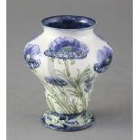 A Moorcroft Macintyre Florian ware pyriform vase, in blue poppies design, green signature W.