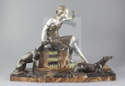 Ugo Cipriani - Uriano (1887-1960). An Art Deco bronzed and silvered spelter group of a lady and