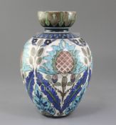 A Burmantofts faience 'Persian' vase, the ovoid body with tulip neck, painted with serrated edged