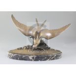 Ganu Gantcheff. An Art Deco bronze model of a seagull flying over waves, signed, on oval marble