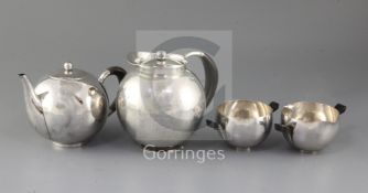A 1930's Johan Rohde for Georg Jensen four-piece planished sterling silver horn-handled tea service,
