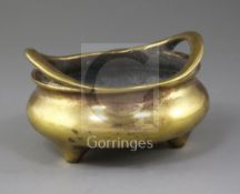 A Chinese bronze ding censer, Xuande mark but 18th/19th century, with a pair of high looped handles,