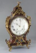 A 19th century French Louis XVI style ormolu mounted red tortoiseshell bracket clock, with enamelled