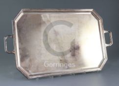 A 1970's silver two handled tea tray by Garrards & Co Ltd, of rectangular form, with canted corners,