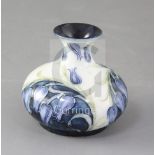 A Moorcroft Macintyre Florian ware squat bulbous vase, decorated with blue harebells, green