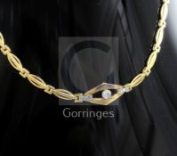 An early-mid 20th century Dutch 14ct? gold and diamond set long necklace, with shaped ovoid links