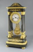 A mid 19th century French bronze and ormolu portico clock, with silvered dial and a countwheel