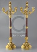 A pair of 19th century, second quarter, French, ormolu and rouge marble four light candelabra,