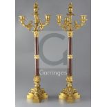 A pair of 19th century, second quarter, French, ormolu and rouge marble four light candelabra,