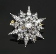 A Victorian gold, silver and diamond set pierced starburst brooch, 33mm.