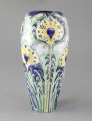 A Moorcroft Macintyre Florian ware tapered baluster vase, stylised peacock feather design, signed in