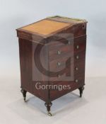 A William IV small mahogany davenport, fitted with writing drawer, slide and four side drawers, on