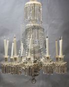 A William IV cut glass twelve light chandelier, with spiral fluted and facetted stem supporting a