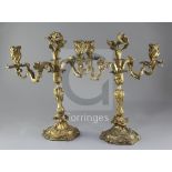 A pair of 19th century French Louis XVI style ormolu candelabra, with scrolling branches and