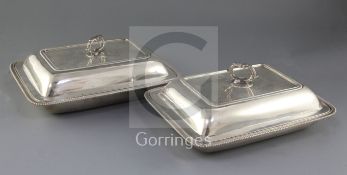 A pair of George IV Irish silver entree dishes and covers, by James Le Bas, of rectangular form,