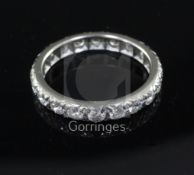 A white gold and diamond full eternity ring, set with twenty round cut stones, size U.