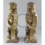 A.W.N. Pugin for Alton Towers. A 'pair' of heavy gilt bronze fire dogs modelled as lions triumphant,