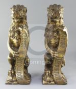 A.W.N. Pugin for Alton Towers. A 'pair' of heavy gilt bronze fire dogs modelled as lions triumphant,