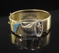 A Victorian gold, blue enamel and old cut diamond set hinged "buckle" bracelet, the interior