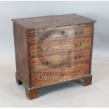 A George III mahogany chest, fitted brushing slide and four graduated long drawers on bracket