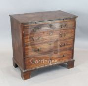 A George III mahogany chest, fitted brushing slide and four graduated long drawers on bracket