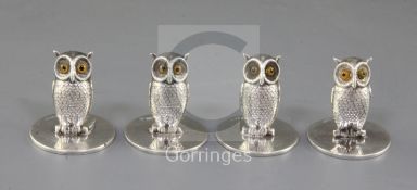 A set of four Edwardian novelty silver owl menu holders, Sampson Mordan & Co, with glass eyes,