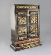 A Chinese gilt-decorated lacquer portable shrine, 19th century, with carved and pierced panels to