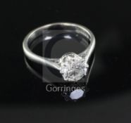 An 18ct white gold solitaire diamond ring, the 1.06cts round brilliant cut diamond with a GIA report