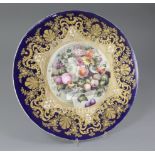 An English porcelain circular plaque, mid 19th century, the centre painted with two birds amid a