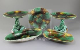 A Victorian Wedgwood fourteen piece Majolica dessert service, moulded with scallop shells with