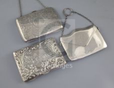 Two late Victorian/Edwardian silver mounted card purses, both with aide memoir and a George V silver