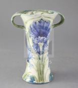 A Moorcroft Macintyre two-handled vase in the Cornflower pattern, brown printed mark, signed in