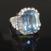 A modern 18ct white gold, blue topaz and diamond set dress ring, the topaz measuring 20.3mm by 16.