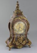 A late 19th century French ormolu mounted red boullework mantel clock, with enamelled tablet